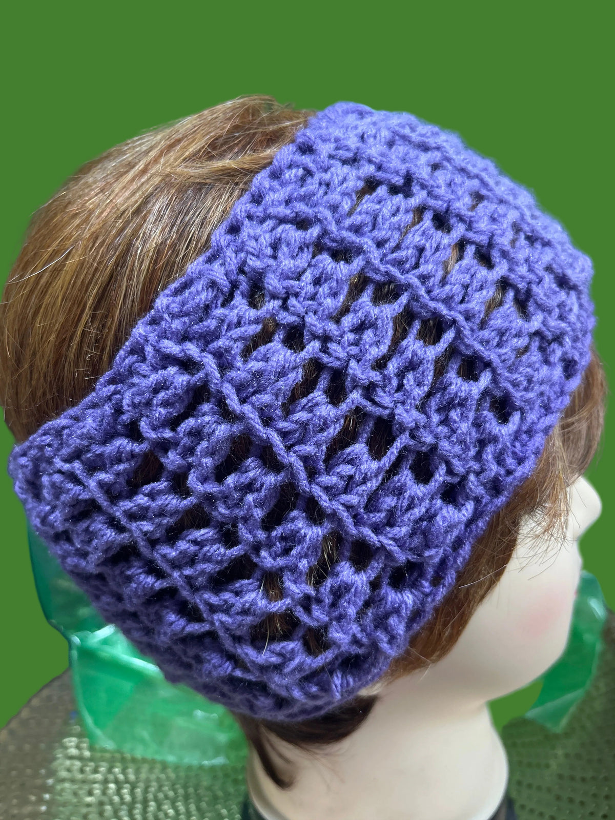 Purple handmade crocheted headband.