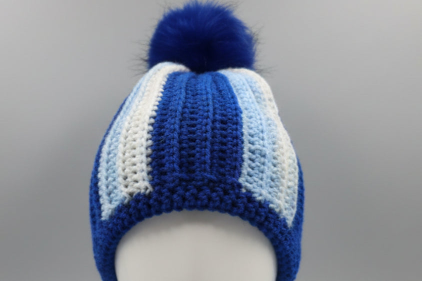 Handmade crocheted beanie in shades of blue.