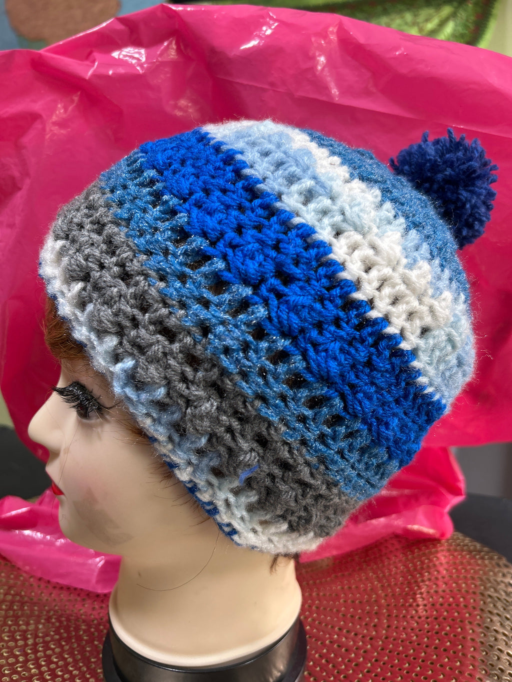 Handmade crocheted beanie in shades of blue, grey & white.
