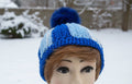 Handmade crocheted beanie in shades of blue.