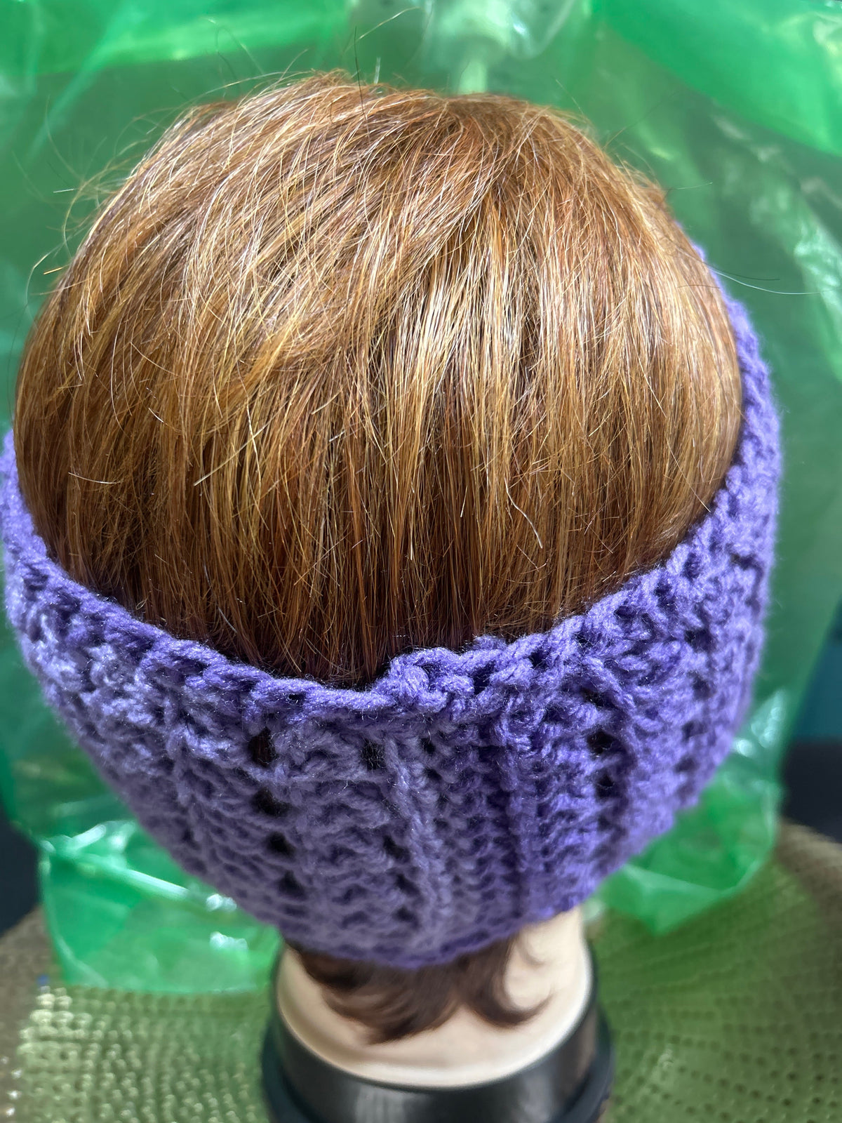 Purple handmade crocheted headband.