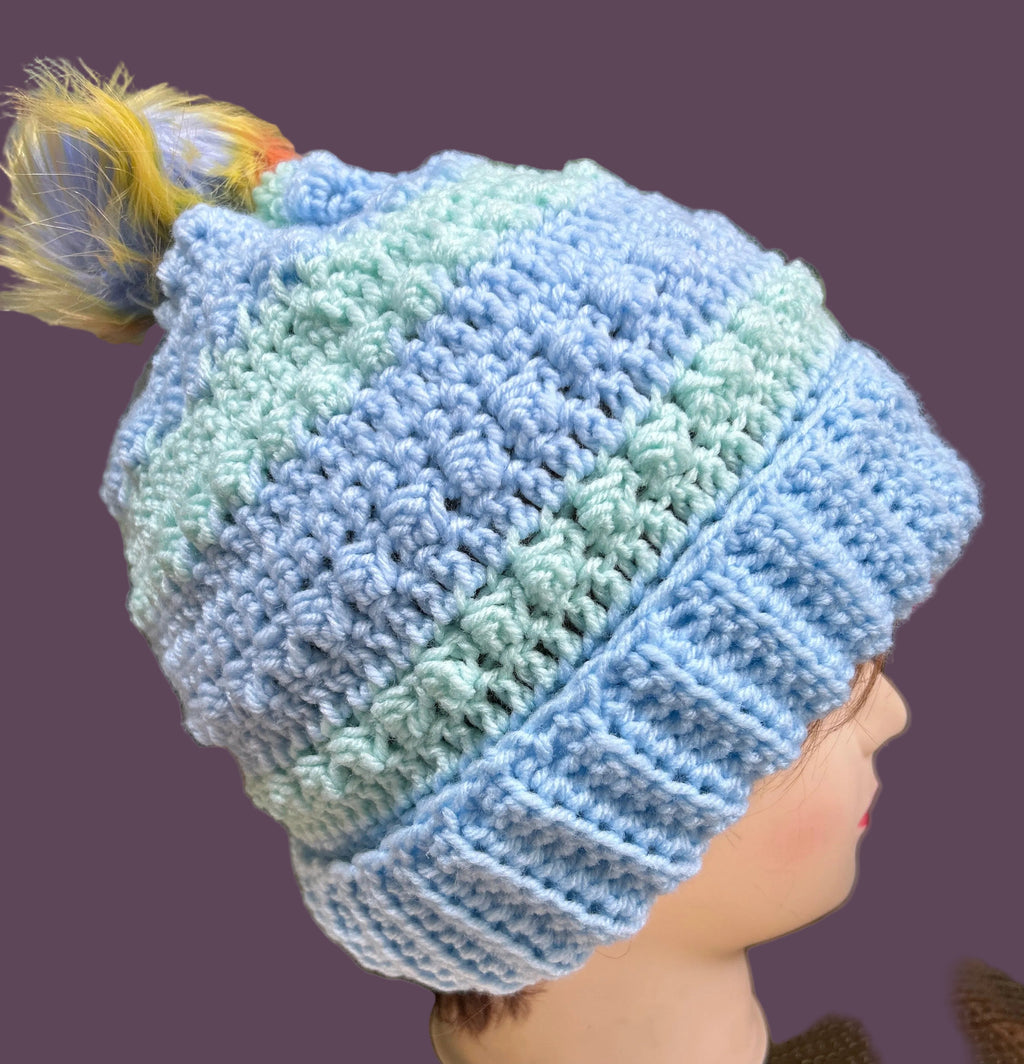 Handmade crocheted beanie/hat in light blue & green.