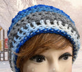 Handmade crocheted beanie in shades of blue, grey & white.