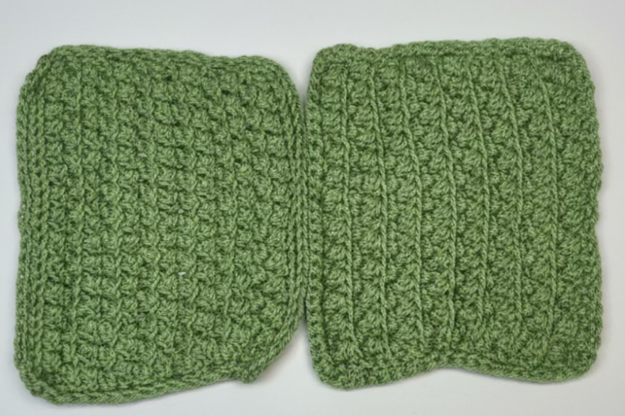 2 handmade crocheted green washcloths.