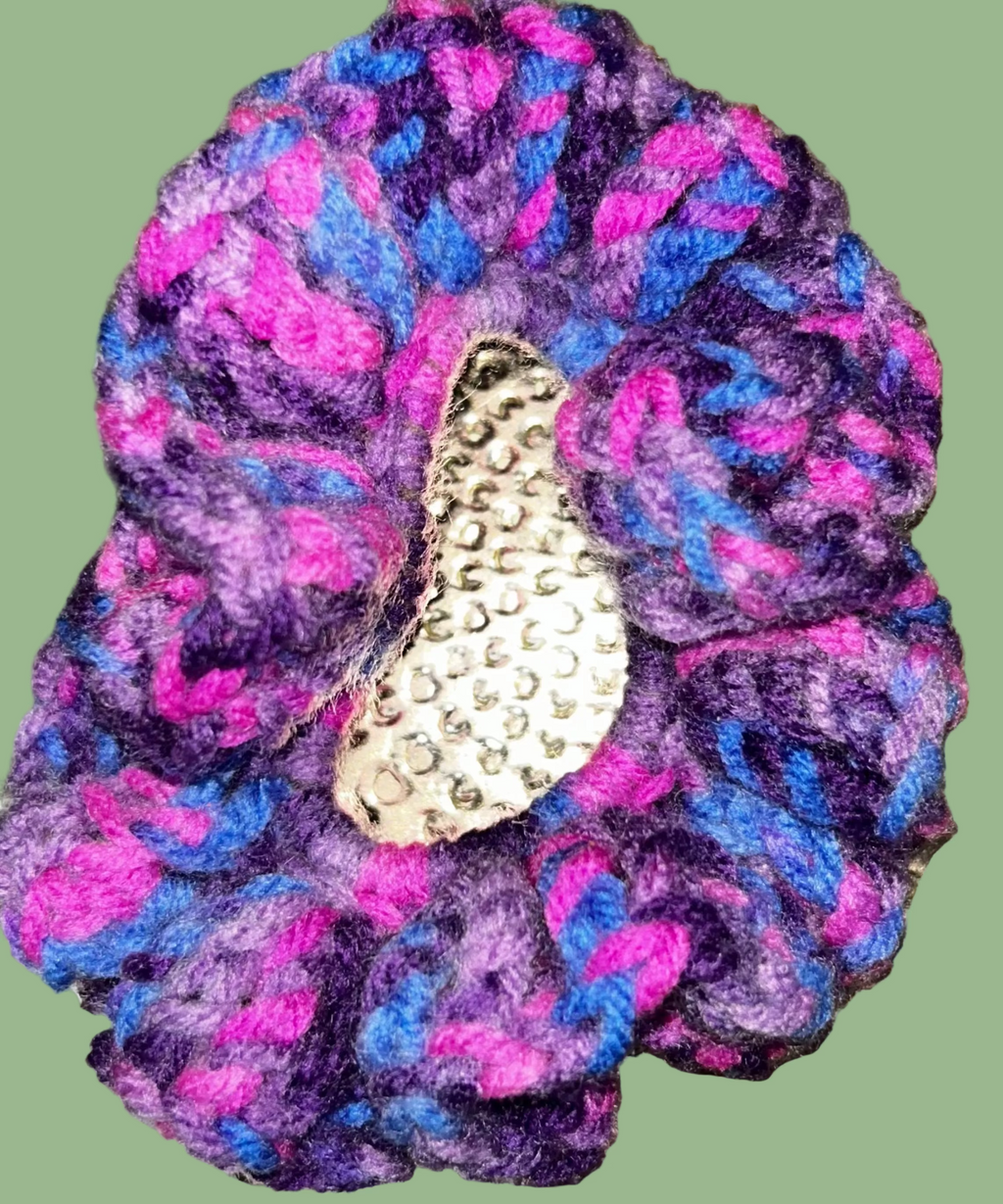 Set of 4 handmade crocheted scrunchies in various colors.