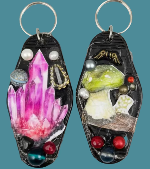 2 retro motel key rings decorated with costume jewelry & decoupage.