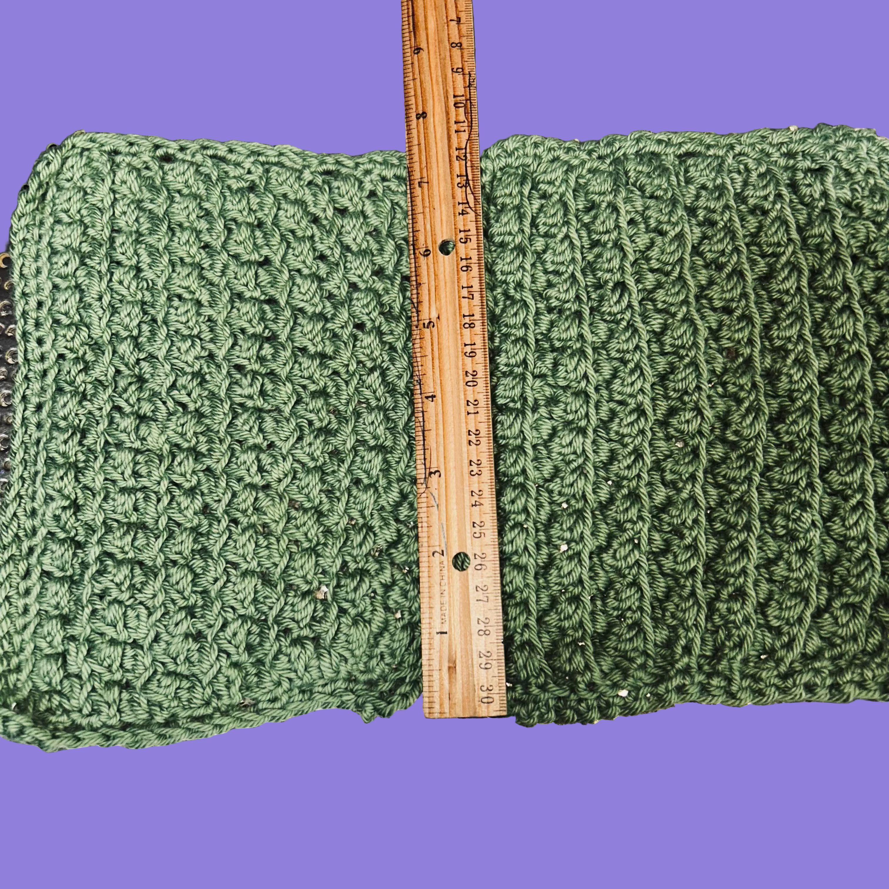 2 handmade crocheted green washcloths.