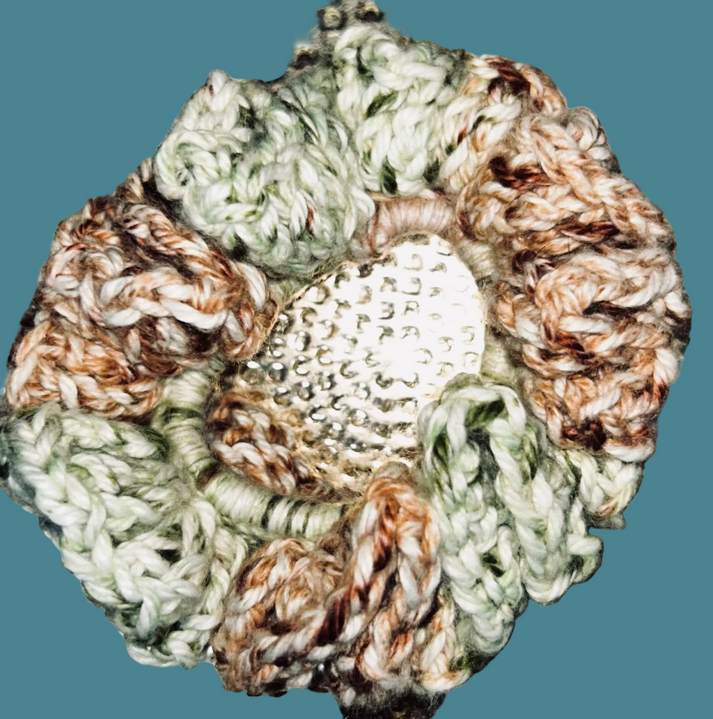 Set of 4 handmade crocheted scrunchies in various colors.