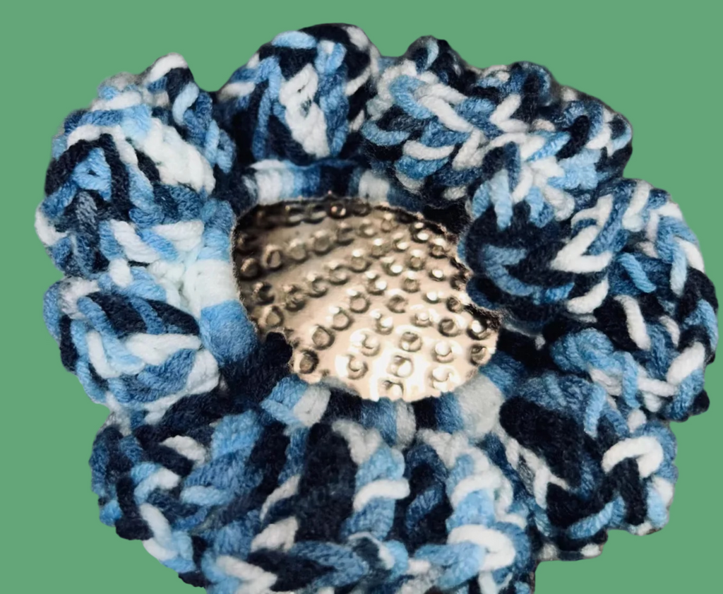 Set of 4 handmade crocheted scrunchies in various colors.