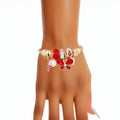 Women’s Gold Cable Bangle Bracelet with Red Butterfly – Stylish Statement Jewelry