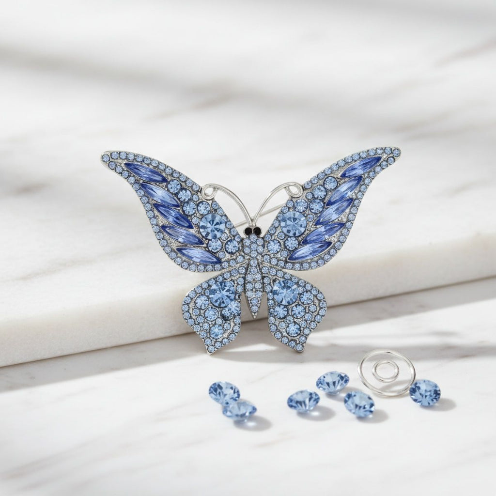 Silver Butterfly Brooch with Light Blue Stone – Stylish Statement Jewelry Accessory