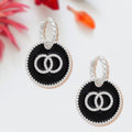 Silver Twisted Hoop Earrings with Black Infinity Charm – Stylish Statement Jewelry
