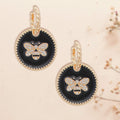 Twisted Gold Hoop Earrings with Black Bee Charm – Stylish Statement Jewelry