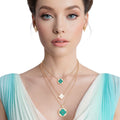 Layered Gold Pendant Necklace with Green Quatrefoil – Stylish Statement Jewelry